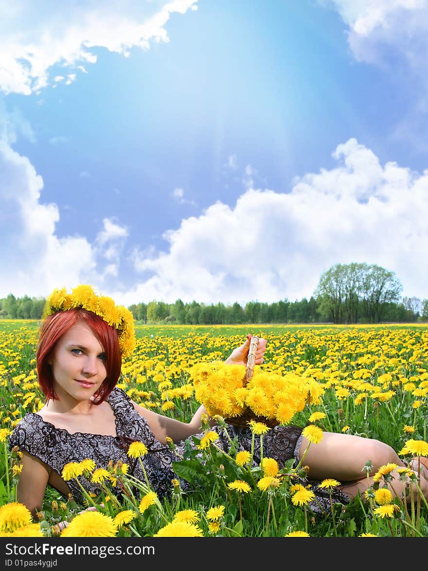 Beautiful redhead girl with dandelions. Beautiful redhead girl with dandelions