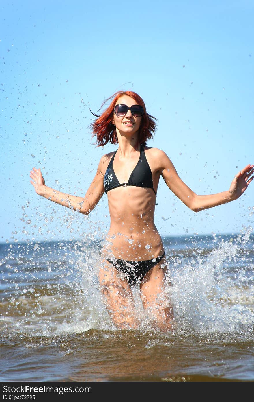 Beautifil girl running on the sea. Beautifil girl running on the sea