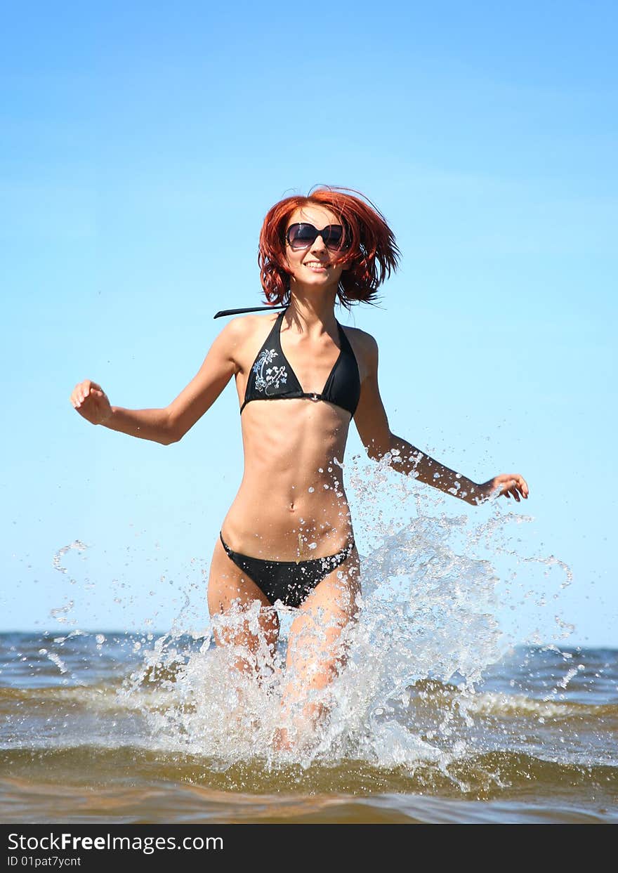 Beautifil girl running on the sea. Beautifil girl running on the sea