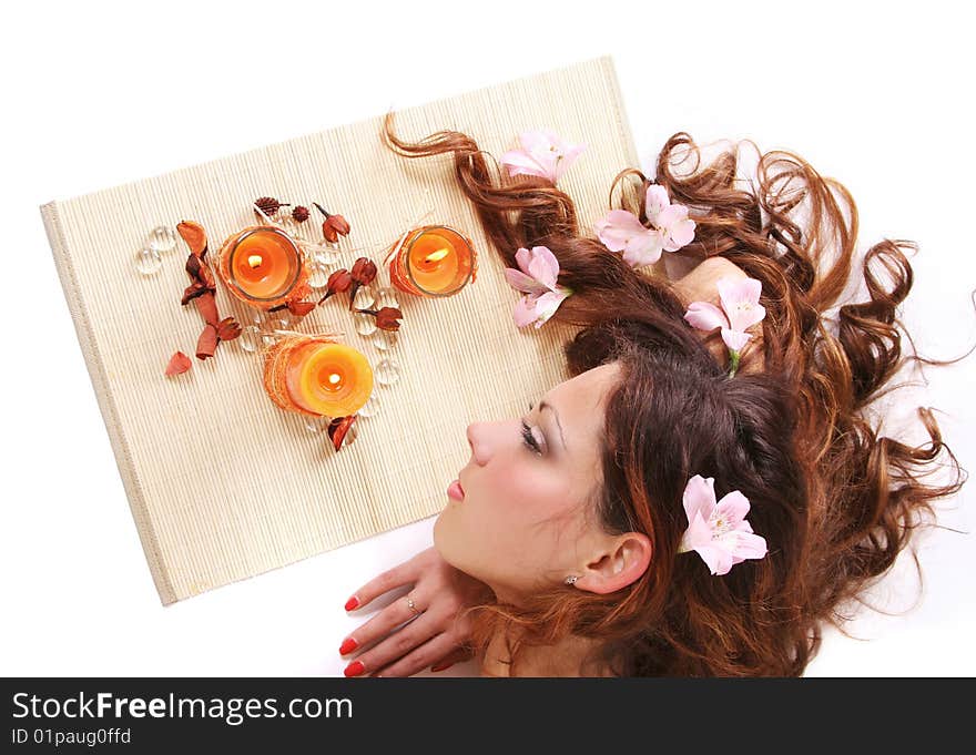 Beautiful long-haired girl relaxing in spa salon. Beautiful long-haired girl relaxing in spa salon