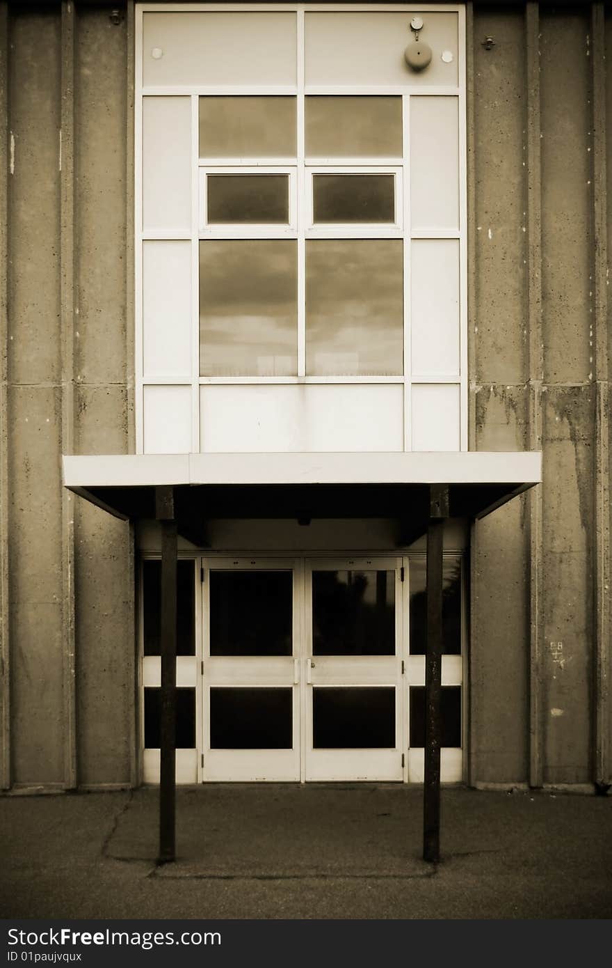 The old doorway and window of an old public school.