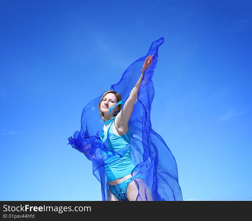 Beautiful young woman with blue scarf. Beautiful young woman with blue scarf