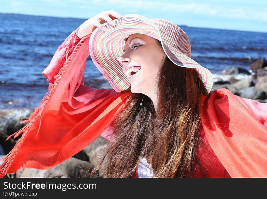 Funny young woman near the sea