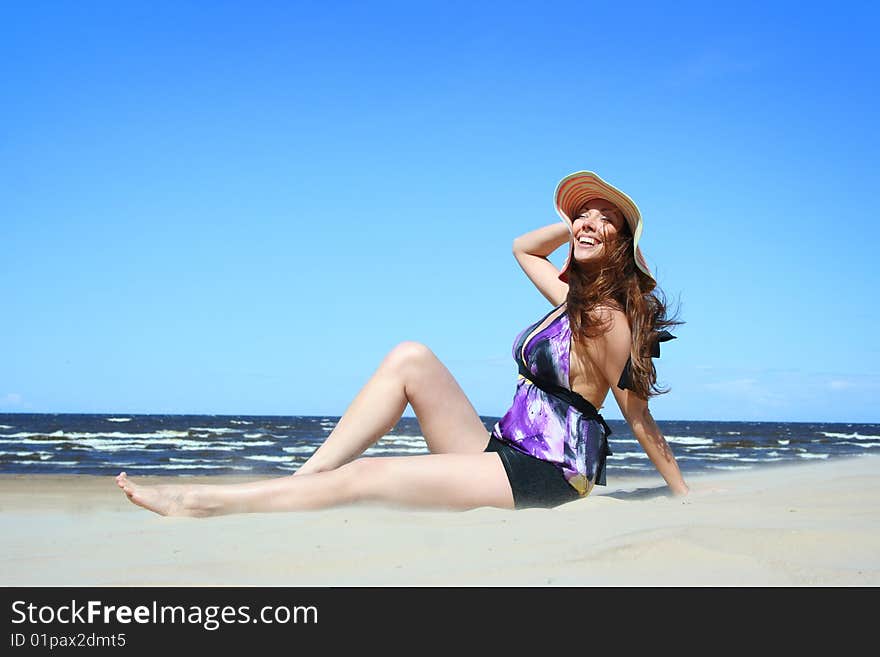 Beautiful young woman relaxing on beach. Beautiful young woman relaxing on beach