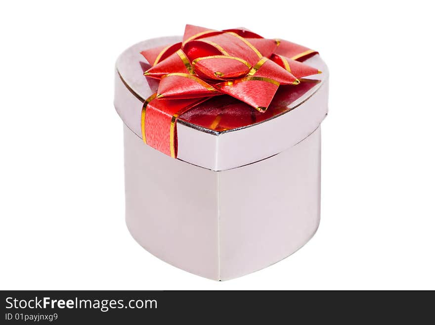 Box in the form of a heart with a bow isolated on a white background. Box in the form of a heart with a bow isolated on a white background