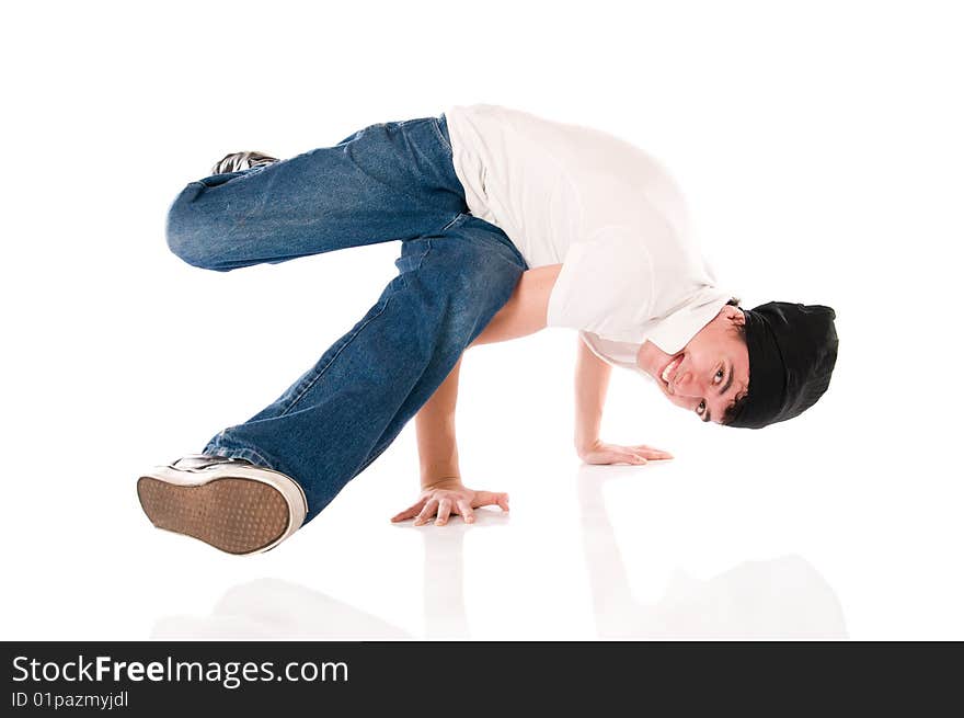 Young happy breakdancer standing on hands with a flying kick. Young happy breakdancer standing on hands with a flying kick