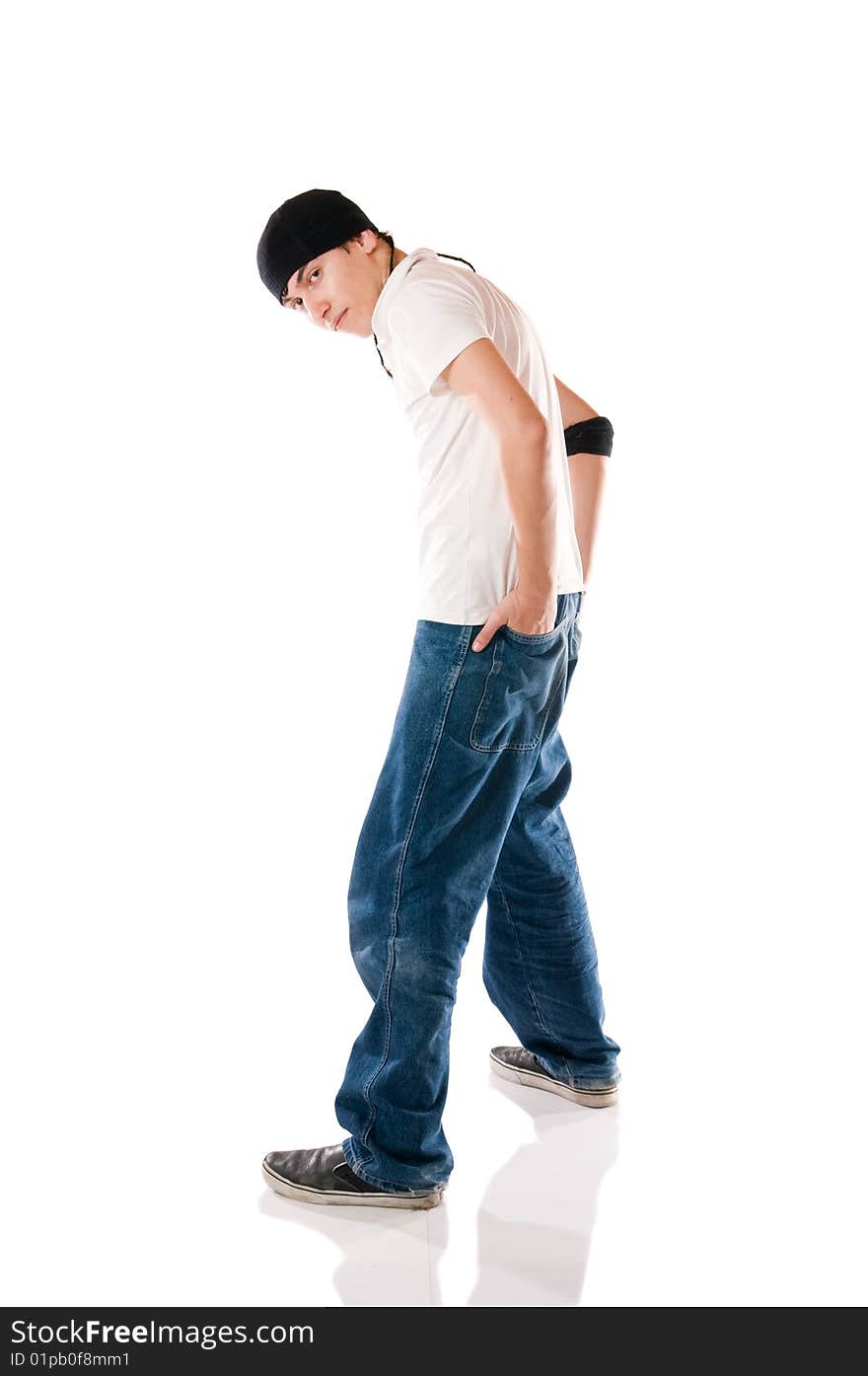 Young breakdancer posing while looking at camera