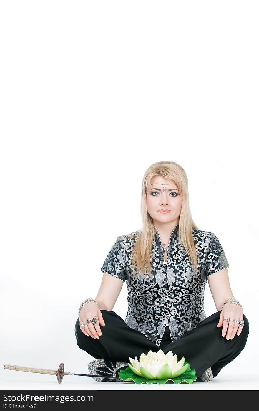 Woman meditating in lotus pose, isolated on white background