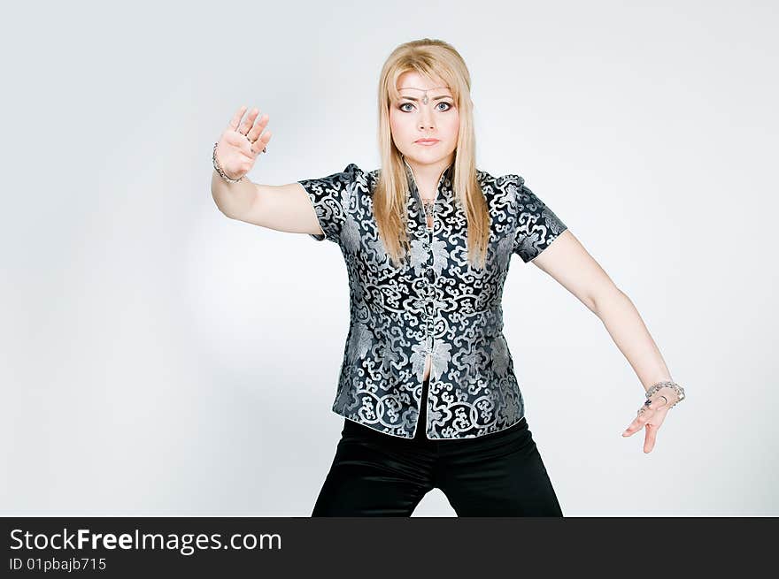 Attractive woman exercising, studio shot