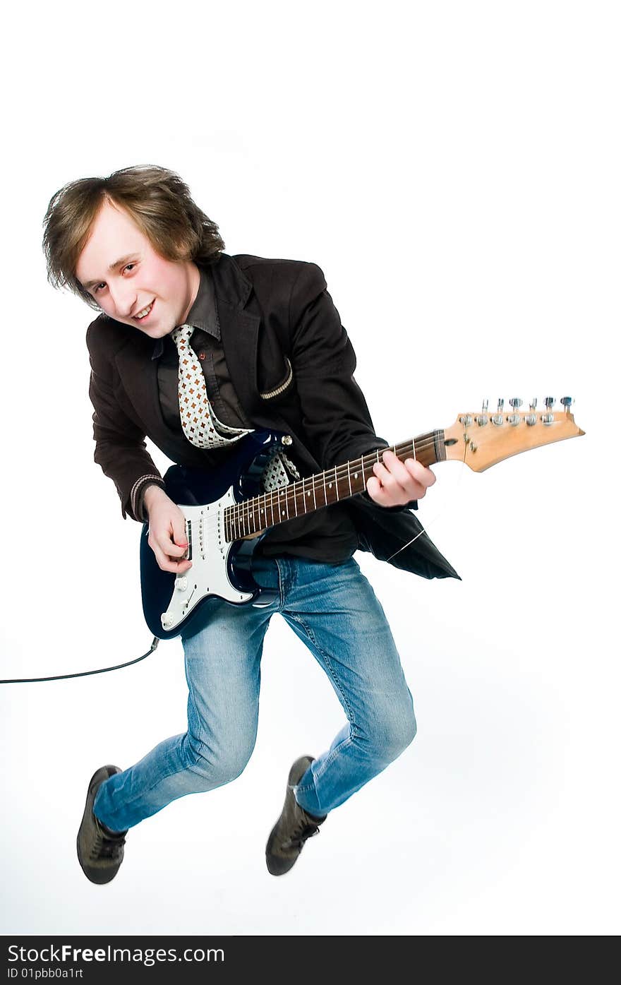 Young man playing electro guitar, motion blur