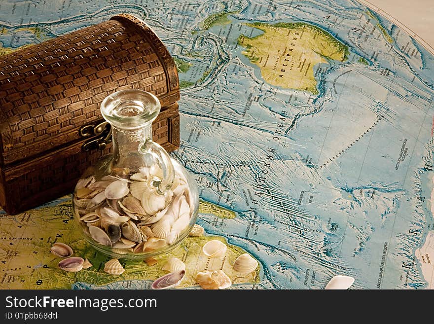 Wooden chest with jug and sea shells