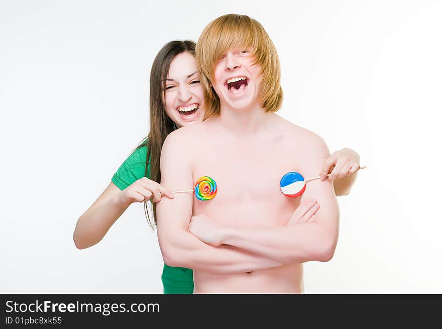 Cheerful girl and boy with lollipops, isolated on white background