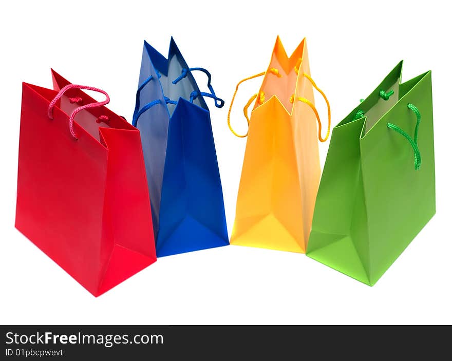 Multi-coloured packages for purchases are isolated on a white background. Multi-coloured packages for purchases are isolated on a white background