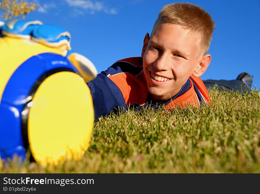 Teenager catching ball on field. Teenager catching ball on field