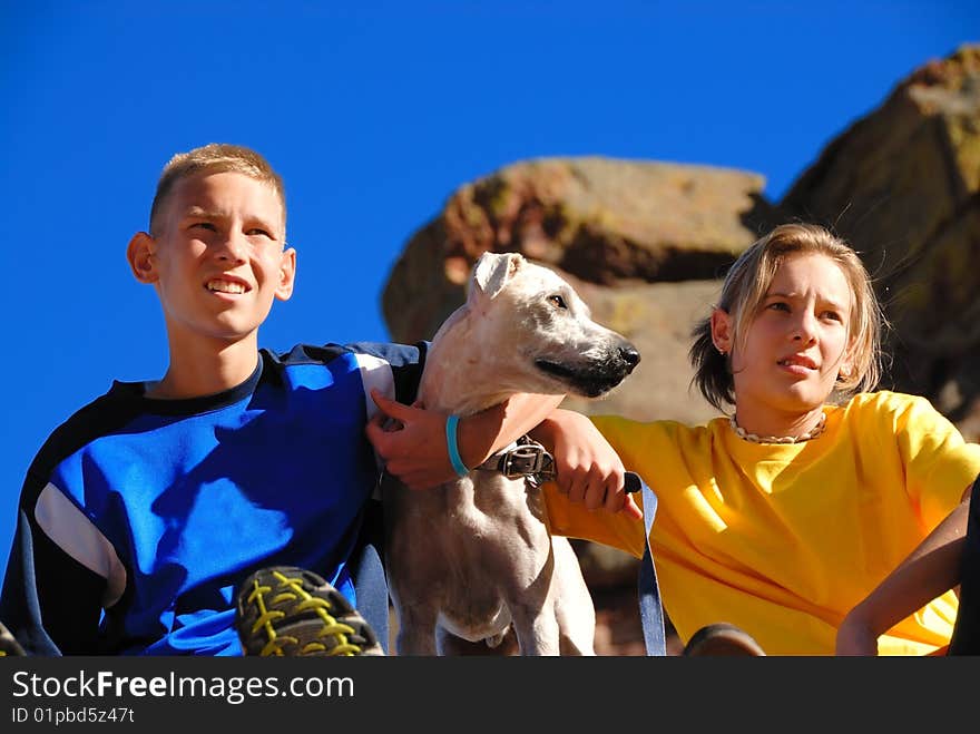 Brother and sister with their dog on a trip. Brother and sister with their dog on a trip