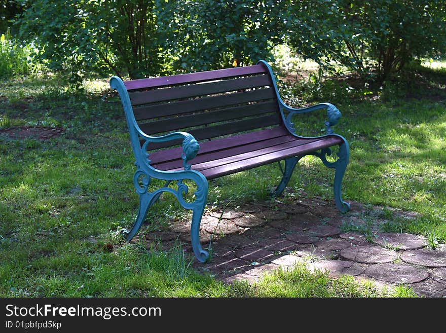 Old design of bench in the park. Old design of bench in the park