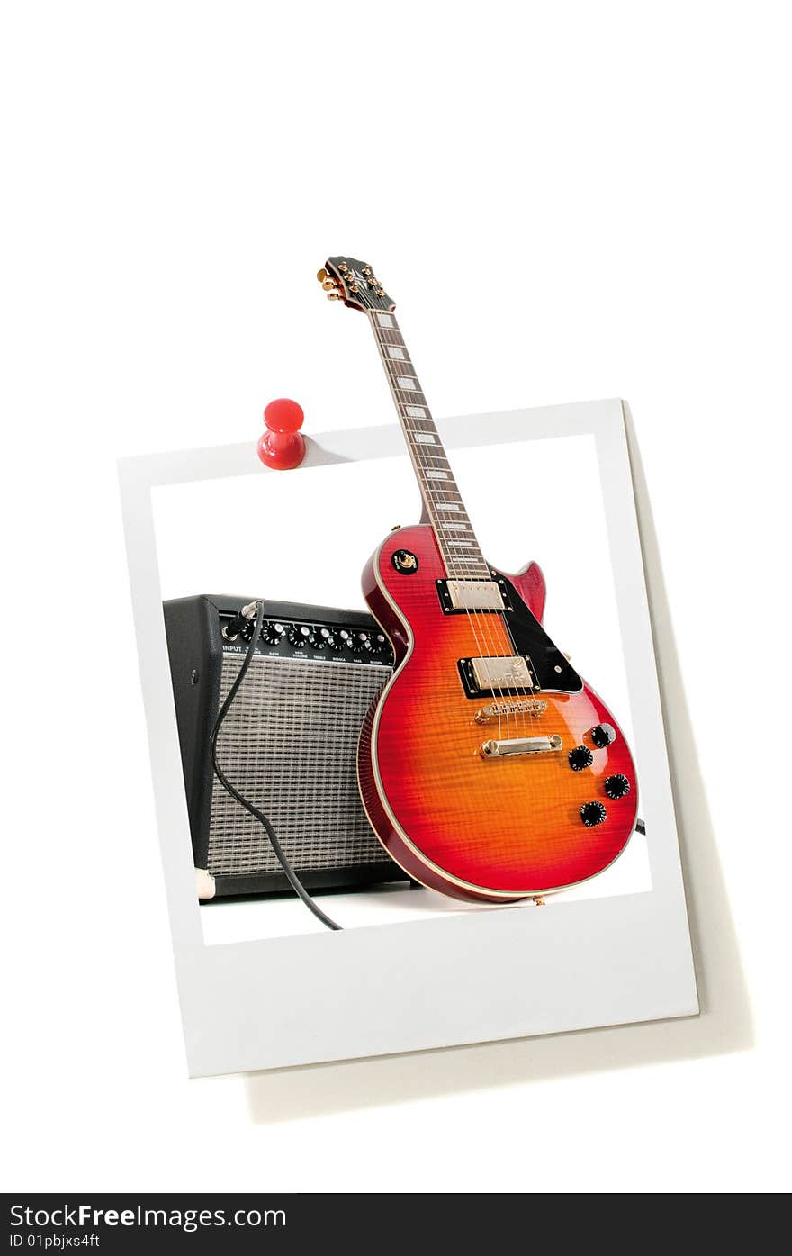 Instant photo print and electric guitar isolated on a white