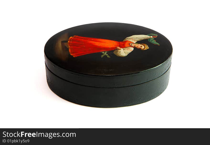 Oval lacquered black Russian casket painted with dancing female peasant isolated. Oval lacquered black Russian casket painted with dancing female peasant isolated