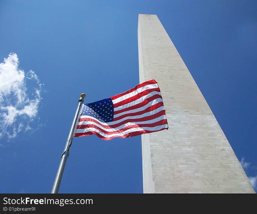 The American Flag flying in front of the Washington Monument.