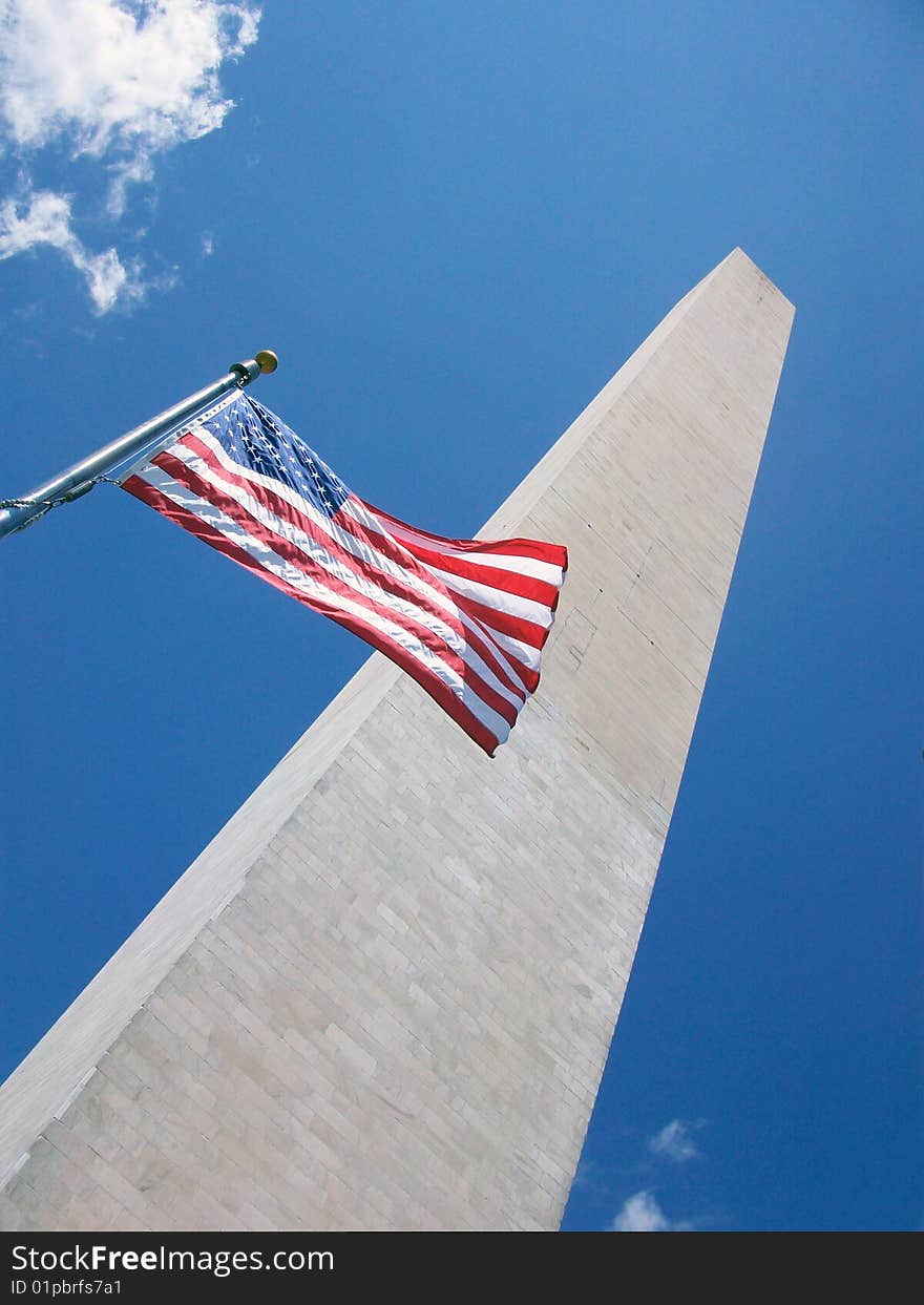 The American Flag flying in front of the Washington Monument.