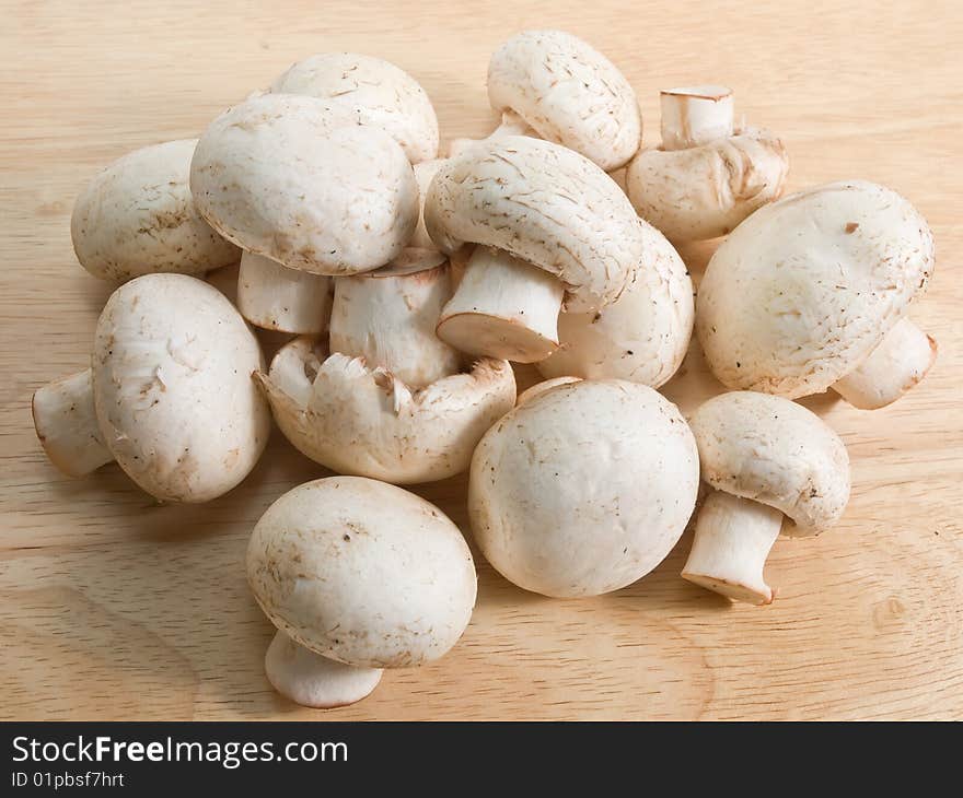 Mushrooms on wooden desk closeup