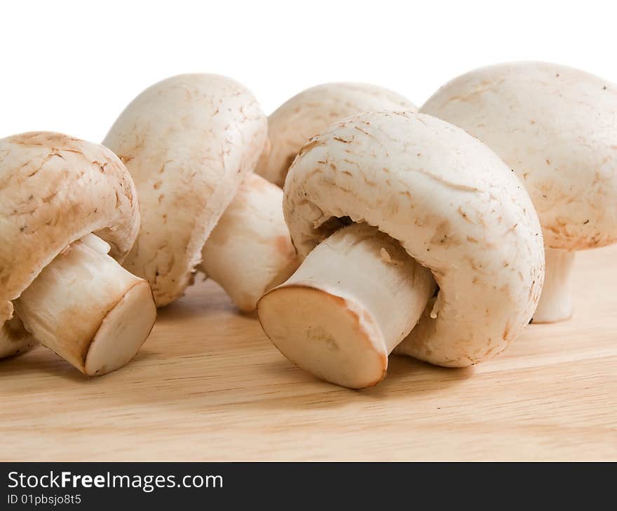 Mushrooms on wooden desk closeup