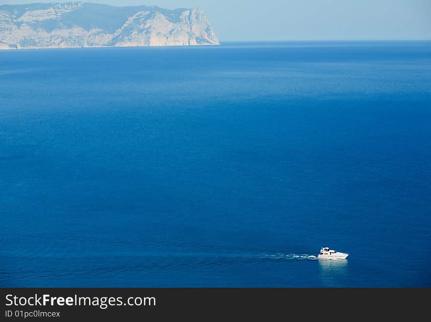 White boat in blue sea