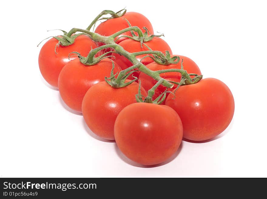 A cluster of cherry tomatoes isolated against a white background