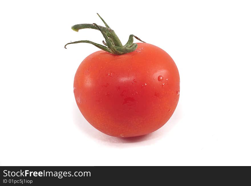 A cherry tomato isolated against a white background