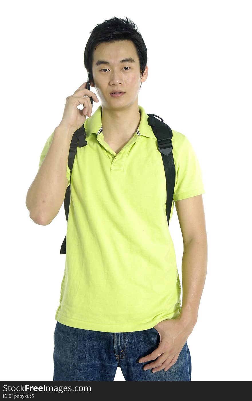 Young man in suit on cell phone and bag. Young man in suit on cell phone and bag