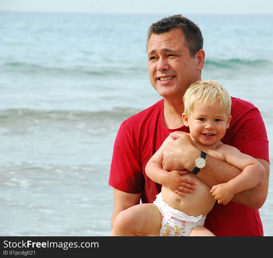 Father and son in the water. Father and son in the water