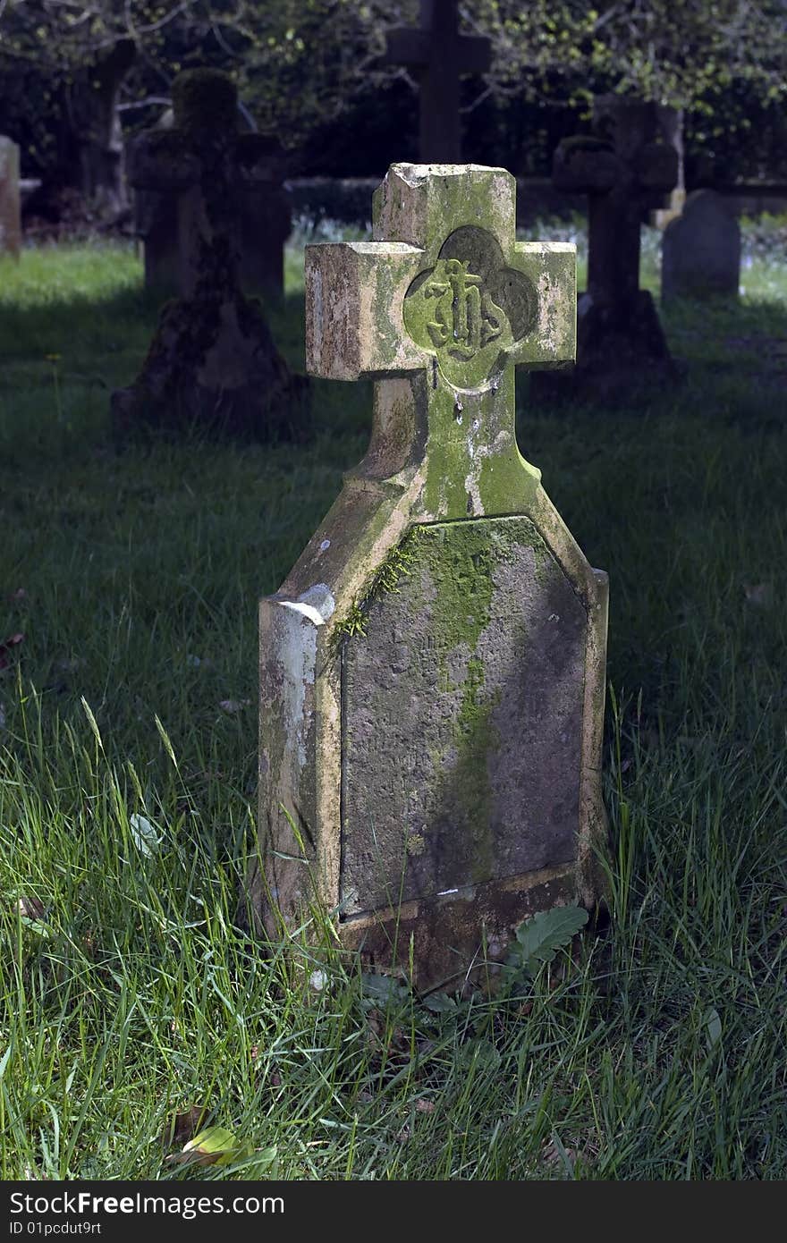 Old gravestone in English country churchyard