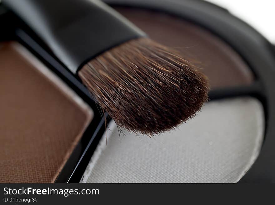 Eyeshadow and makeup brush.