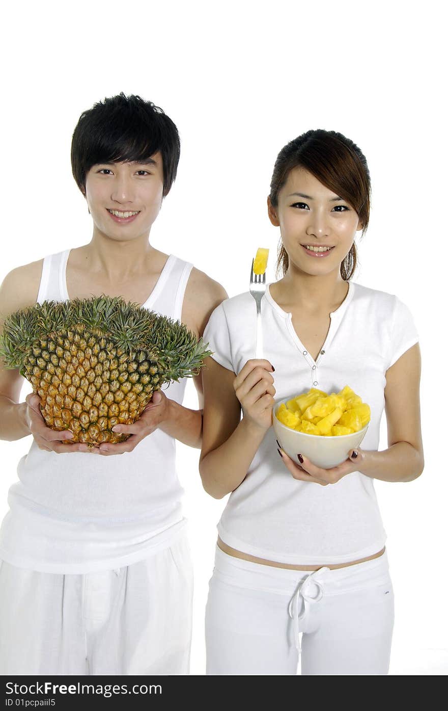 Couple eating and hold pineapple. Couple eating and hold pineapple