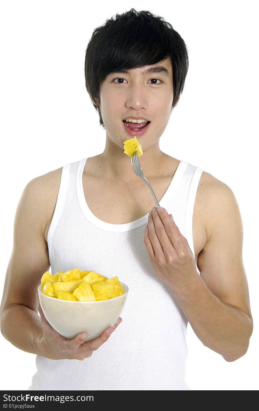 Young asian man eating and hold pineapple. Young asian man eating and hold pineapple