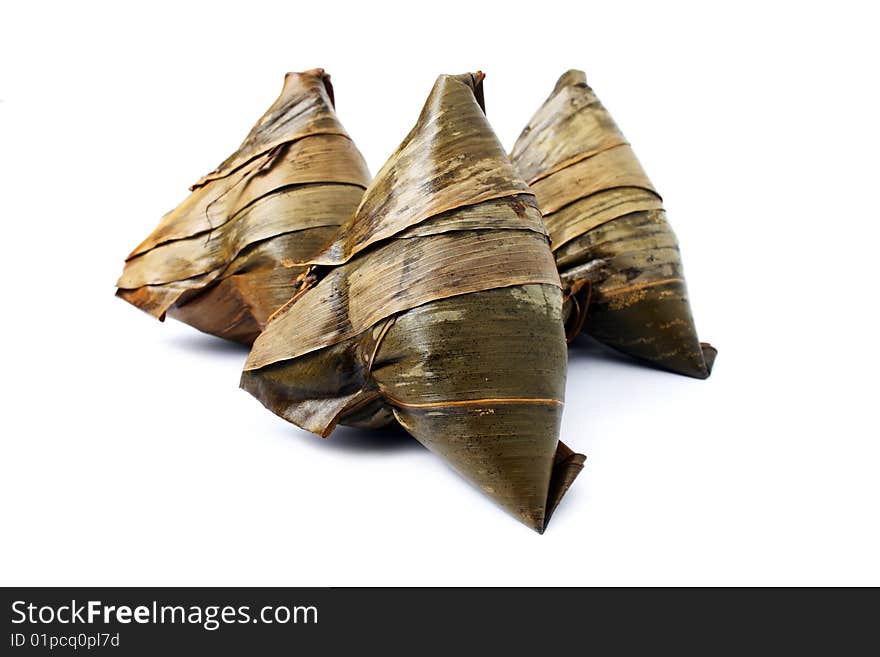 Three rice dumplings (Chinese traditional food) isolated on white background.