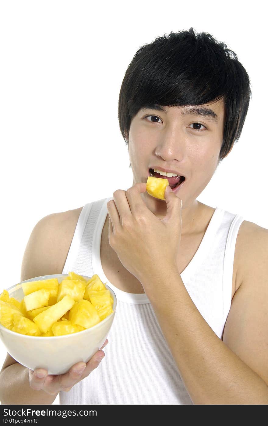 Young asian man eating and hold pineapple. Young asian man eating and hold pineapple