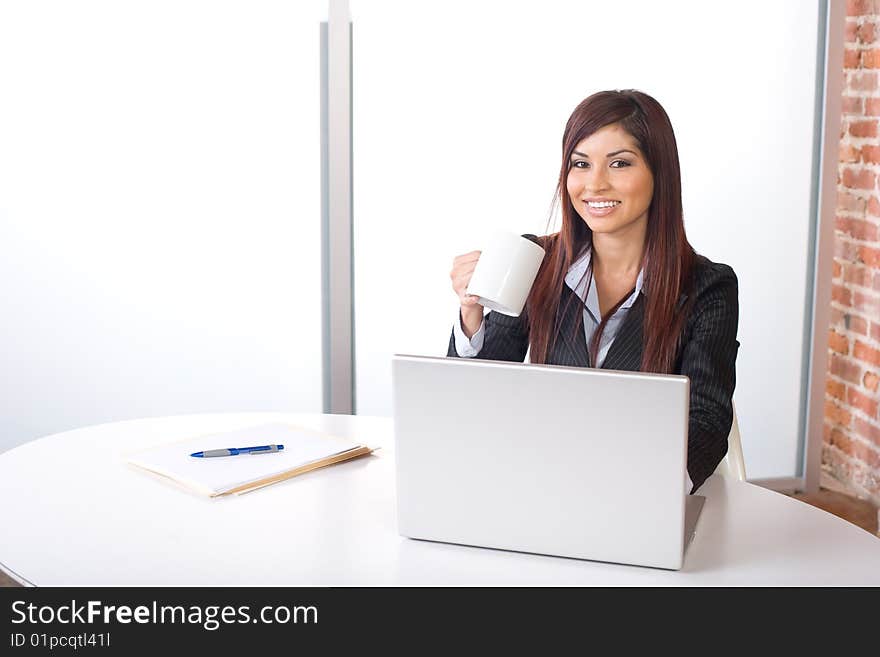 BUsiness woman having her morning coffee