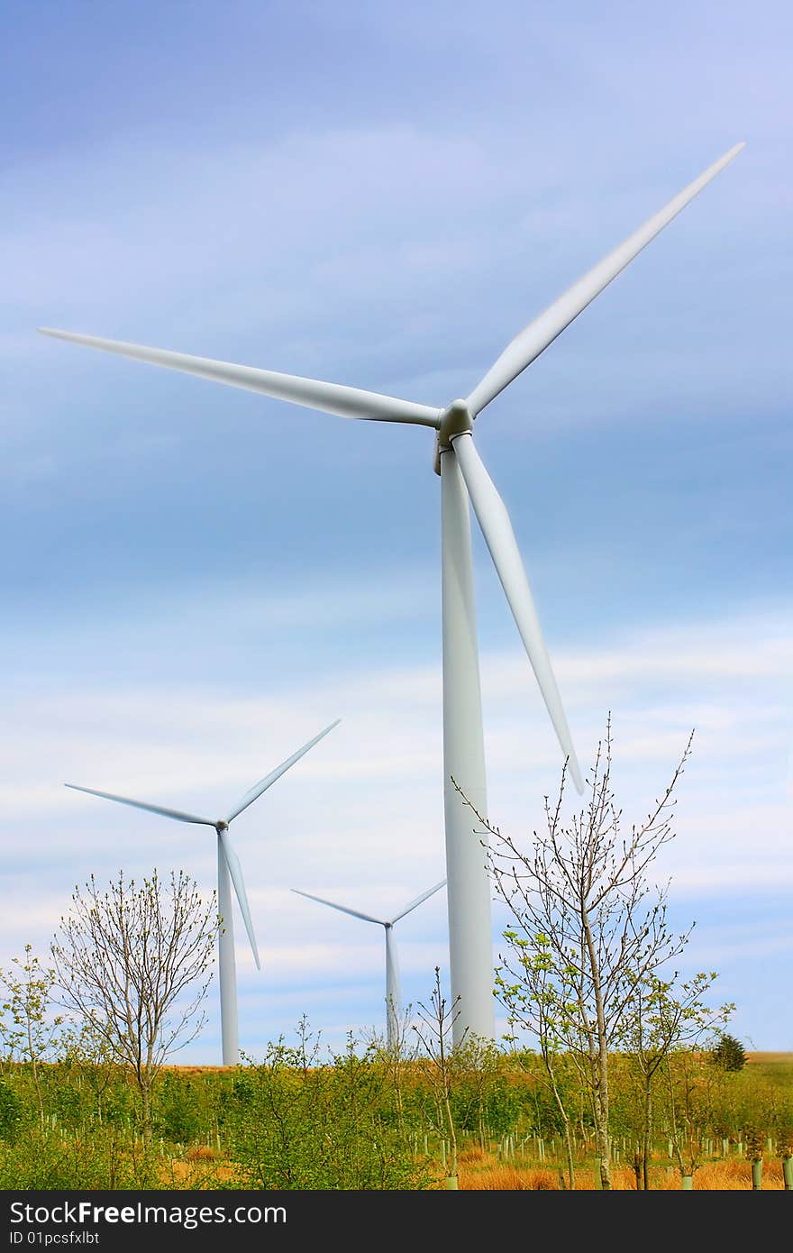 Modern windmills against blue sky