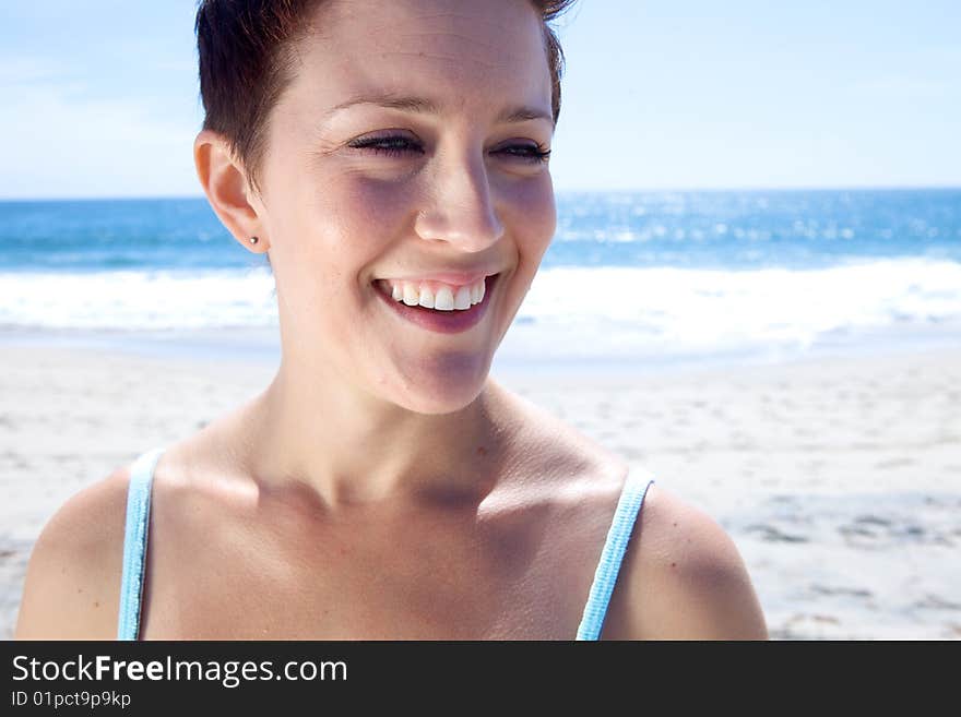 Beautiful Brunette looks at the beach