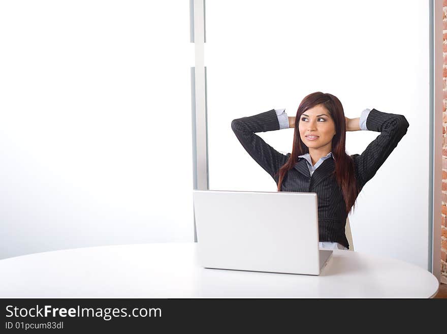 Business woman relaxing in a modern office