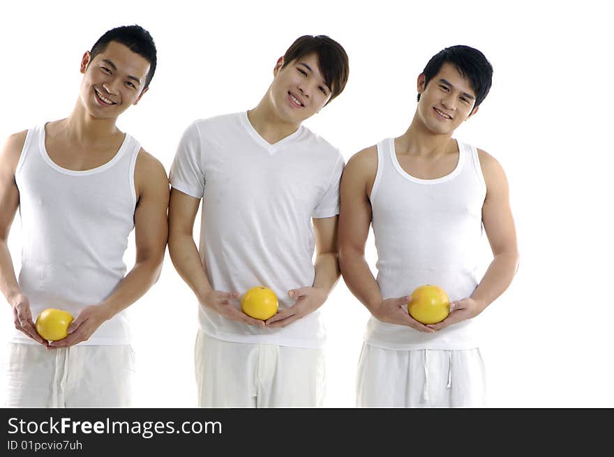 Three young man holding grapefruit. Three young man holding grapefruit