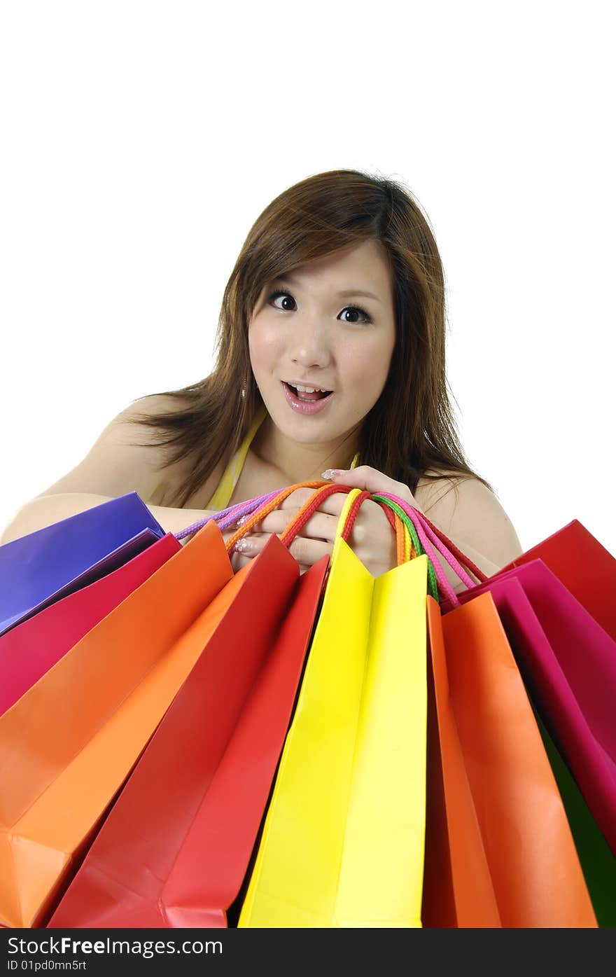 Portrait of one happy young adult girl with colored bags. Portrait of one happy young adult girl with colored bags