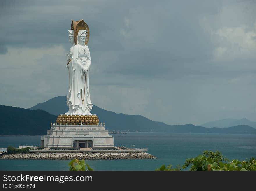 Enormous statue Budda on background storm sky