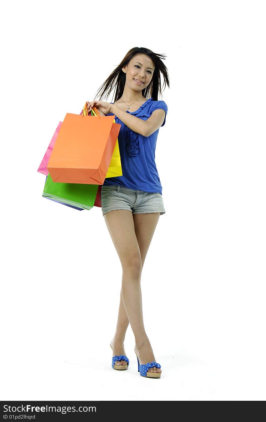 Portrait of one happy young adult girl with colored bags. Portrait of one happy young adult girl with colored bags