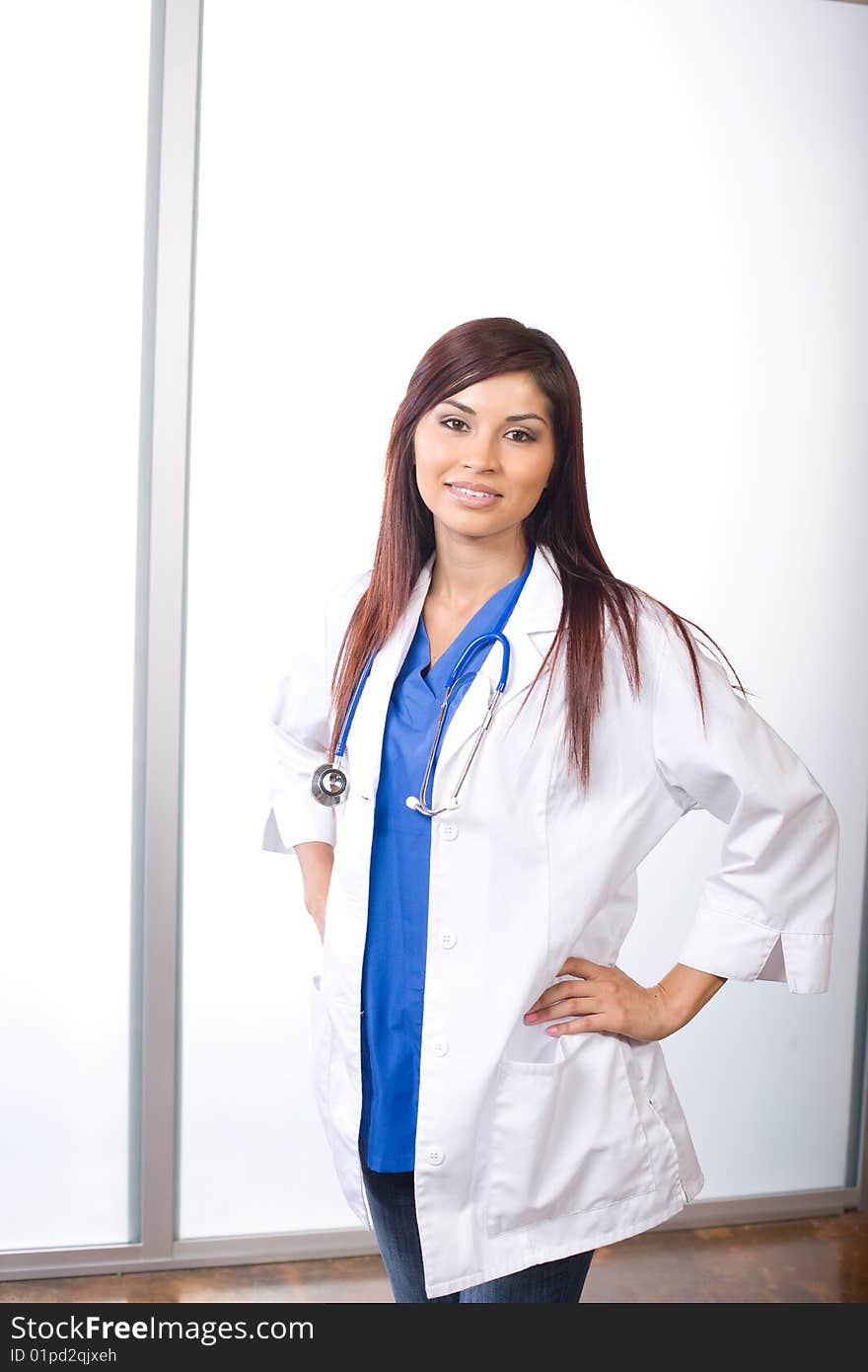 Young female doctor standing in a modern office