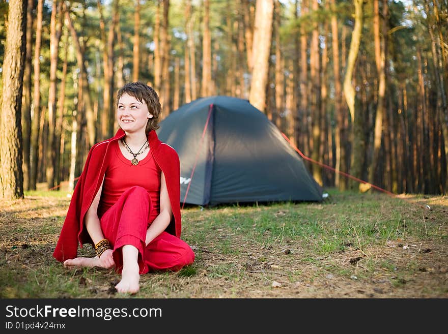 A pretty young woman relaxing in the forest. A pretty young woman relaxing in the forest