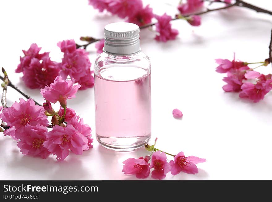 Beautiful red flowers and spa liquid. Beautiful red flowers and spa liquid