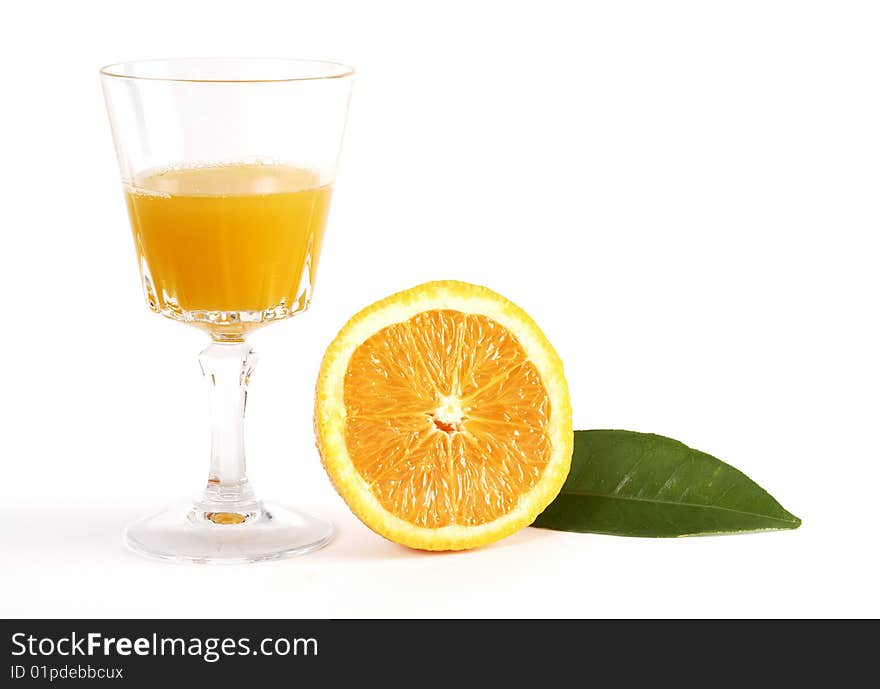 Orange juice in glass with sliced orange