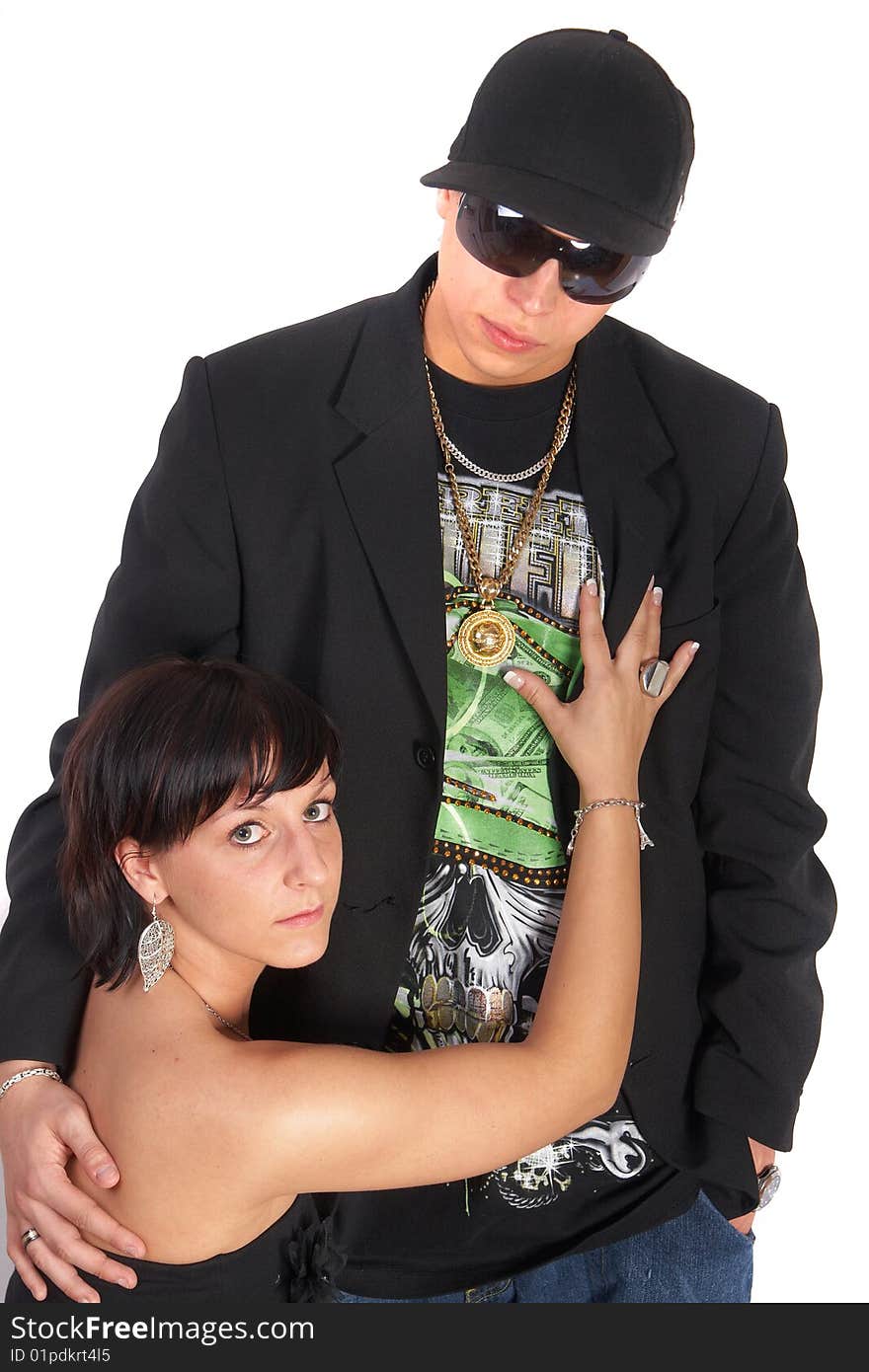 Young stylish couple is posing in style! Isolated over white.